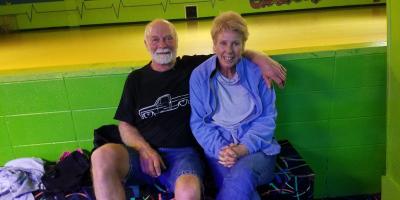 Fun for all ages, older couple enjoying skateworld